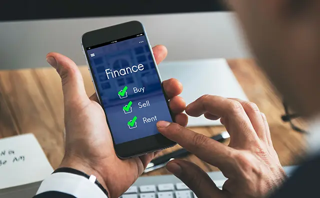 Fintech app on smartphone displays Buy, Sell, and Rent options for real estate.